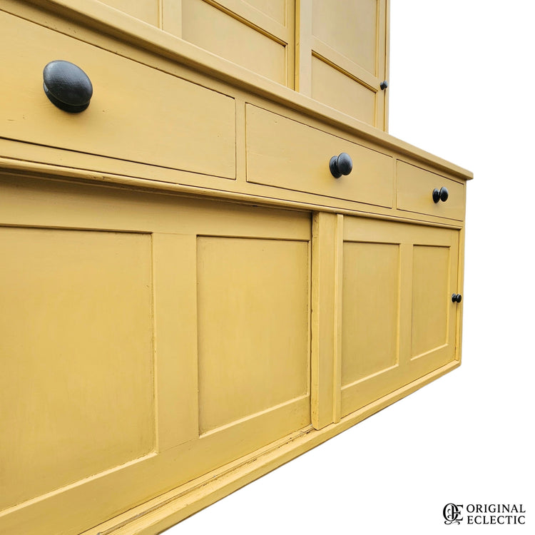 Large mustard yellow antique pine housekeepers cupboard