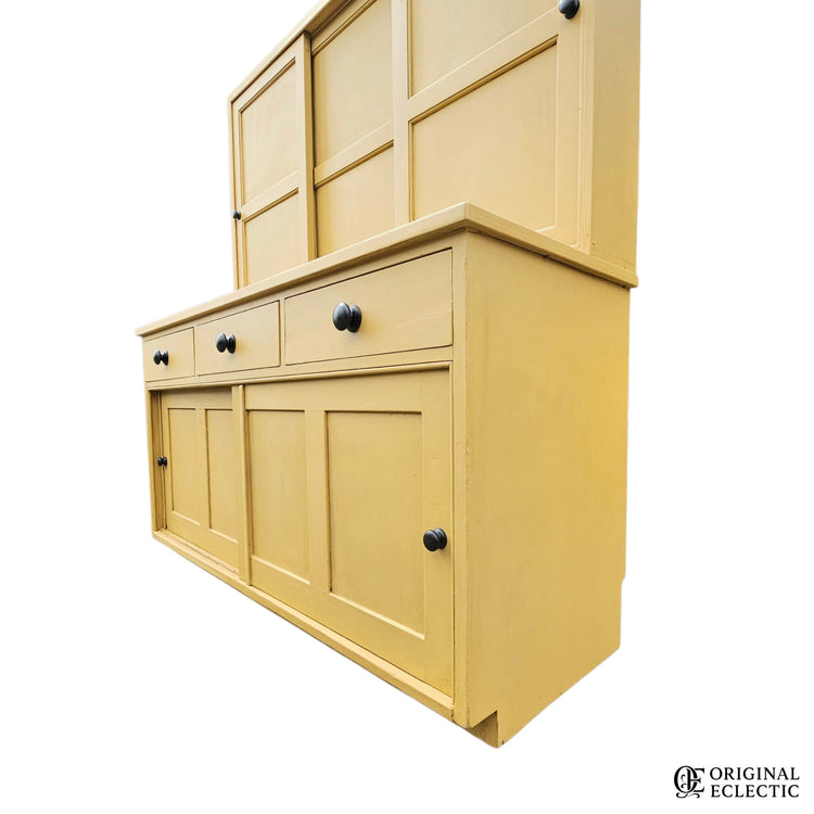 Large mustard yellow antique pine housekeepers cupboard