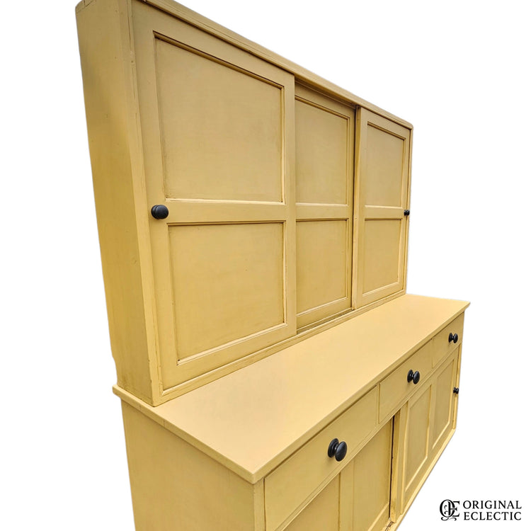 Large mustard yellow antique pine housekeepers cupboard